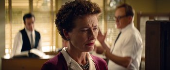 Movie still from “Saving Mr. Banks” (2013), directed by John Lee Hancock – An older woman wearing a necklace and a red sweater; Close Up shot, Over the shoulder angle
