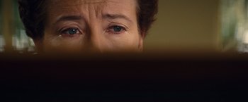 Movie still from “Saving Mr. Banks” (2013), directed by John Lee Hancock – A person's eyes with a book in the background; Extreme Close Up shot, Overhead angle