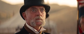 Movie still from “Saving Mr. Banks” (2013), directed by John Lee Hancock – An older man with a mustache wearing a hat; Close Up shot, Low angle