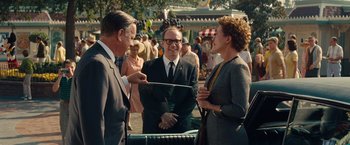 Movie still from “Saving Mr. Banks” (2013), directed by John Lee Hancock – Two men and a woman in a crowd of onlookers; Medium shot, Over the shoulder angle