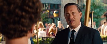 Movie still from “Saving Mr. Banks” (2013), directed by John Lee Hancock – A man in a suit and tie standing next to a woman; Close Up shot, Over the shoulder angle