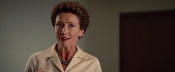 Movie still from “Saving Mr. Banks” (2013), directed by John Lee Hancock – An older woman wearing a white shirt and a necklace; Close Up shot, Over the shoulder angle