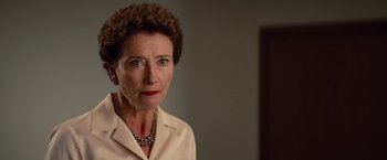 Movie still from “Saving Mr. Banks” (2013), directed by John Lee Hancock – An older woman wearing a white shirt and a necklace; Close Up shot, Over the shoulder angle