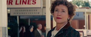 Movie still from “Saving Mr. Banks” (2013), directed by John Lee Hancock – A person wearing a suit and tie; Close Up shot, Over the shoulder angle