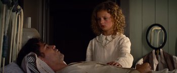 Movie still from “Saving Mr. Banks” (2013), directed by John Lee Hancock – A young girl standing next to an older man; Medium shot, High angle