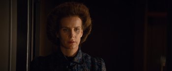 Movie still from “Saving Mr. Banks” (2013), directed by John Lee Hancock – A woman in a blue dress with a black background; Close Up shot, Low angle