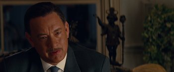 Movie still from “Saving Mr. Banks” (2013), directed by John Lee Hancock – A person wearing a suit and tie; Close Up shot, Over the shoulder angle