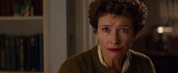 Movie still from “Saving Mr. Banks” (2013), directed by John Lee Hancock – An older woman with short curly hair wearing a sweater; Close Up shot, Over the shoulder angle