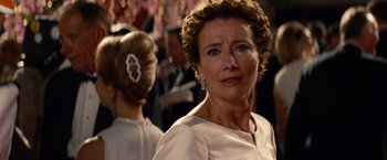 Movie still from “Saving Mr. Banks” (2013), directed by John Lee Hancock – An older woman in a white dress looking at the camera; Close Up shot, Over the shoulder angle