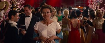 Movie still from “Saving Mr. Banks” (2013), directed by John Lee Hancock – A woman standing in front of a group of people; Medium shot, Over the shoulder angle