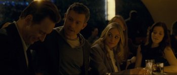 Movie still from “Shame” (2011), directed by Steve McQueen – A man and a woman sitting next to each other; Medium shot, Over the shoulder angle