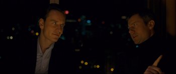 Movie still from “Shame” (2011), directed by Steve McQueen – A person looking out a window at night; Close Up shot, Over the shoulder angle
