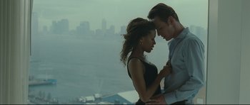 Movie still from “Shame” (2011), directed by Steve McQueen – A man and a woman standing next to each other on top of a building; Medium shot, High angle