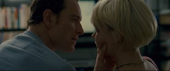 Movie still from “Shame” (2011), directed by Steve McQueen – A man and a woman looking at each other's face; Close Up shot, Over the shoulder angle