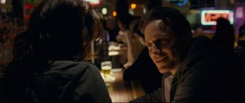 Movie still from “Shame” (2011), directed by Steve McQueen – A man and a woman sitting at a bar; Close Up shot, Over the shoulder angle