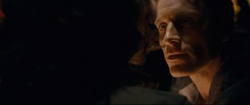 Movie still from “Shame” (2011), directed by Steve McQueen – A man's face in the dark; Close Up shot, Over the shoulder angle