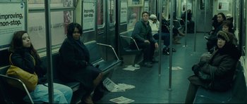 Movie still from “Shame” (2011), directed by Steve McQueen – A group of people sitting on a subway train; Wide shot, Over the shoulder angle