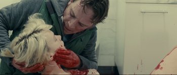 Movie still from “Shame” (2011), directed by Steve McQueen – A man with blood on his face and hands; Close Up shot, Over the shoulder angle