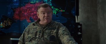 Movie still from “Edge of Tomorrow” (2014), directed by Doug Liman – A person wearing a military uniform; Close Up shot, Over the shoulder angle