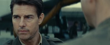 Movie still from “Edge of Tomorrow” (2014), directed by Doug Liman – A person wearing a jacket; Close Up shot, Over the shoulder angle