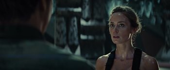 Movie still from “Edge of Tomorrow” (2014), directed by Doug Liman – A man and a woman are standing next to each other; Close Up shot, Over the shoulder angle