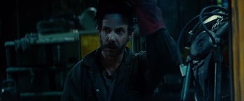 Movie still from “Edge of Tomorrow” (2014), directed by Doug Liman – A person wearing a hat; Close Up shot, Over the shoulder angle