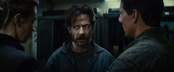 Movie still from “Edge of Tomorrow” (2014), directed by Doug Liman – A person with a beard; Close Up shot, Over the shoulder angle