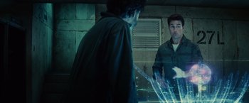 Movie still from “Edge of Tomorrow” (2014), directed by Doug Liman – Two men are looking at each other in the mirror; Medium shot, Over the shoulder angle