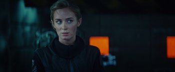 Movie still from “Edge of Tomorrow” (2014), directed by Doug Liman – A person wearing a black jacket; Close Up shot, Over the shoulder angle