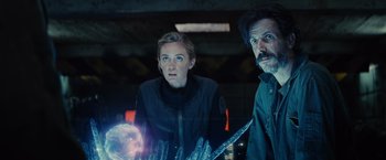 Movie still from “Edge of Tomorrow” (2014), directed by Doug Liman – A man and a woman are looking at something; Medium shot, Over the shoulder angle