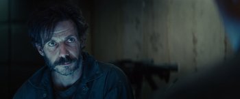 Movie still from “Edge of Tomorrow” (2014), directed by Doug Liman – A person with a beard; Close Up shot, Over the shoulder angle