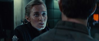 Movie still from “Edge of Tomorrow” (2014), directed by Doug Liman – A woman looking at a man in the mirror; Close Up shot, Over the shoulder angle
