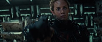Movie still from “Edge of Tomorrow” (2014), directed by Doug Liman – A person holding a gun; Close Up shot, Over the shoulder angle