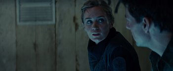 Movie still from “Edge of Tomorrow” (2014), directed by Doug Liman – A woman with blue eyes stares into the camera; Close Up shot, Over the shoulder angle