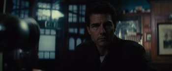 Movie still from “Edge of Tomorrow” (2014), directed by Doug Liman – A person in a dark room; Close Up shot, Low angle