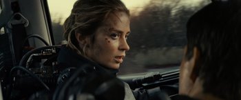 Movie still from “Edge of Tomorrow” (2014), directed by Doug Liman – A person riding in a car; Close Up shot, Over the shoulder angle