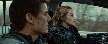 Movie still from “Edge of Tomorrow” (2014), directed by Doug Liman – A man and a woman sitting in a car; Close Up shot, Over the shoulder angle