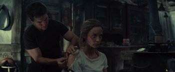 Movie still from “Edge of Tomorrow” (2014), directed by Doug Liman – A woman getting her hair combed by a man; Close Up shot, Over the shoulder angle
