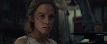 Movie still from “Edge of Tomorrow” (2014), directed by Doug Liman – A person with a scar on their face; Close Up shot, Over the shoulder angle