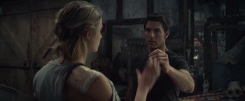 Movie still from “Edge of Tomorrow” (2014), directed by Doug Liman – A man and a woman looking at each other in a mirror; Close Up shot, Over the shoulder angle