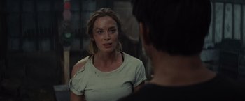 Movie still from “Edge of Tomorrow” (2014), directed by Doug Liman – A woman in white shirt looking at a man in black shirt; Medium shot, Over the shoulder angle