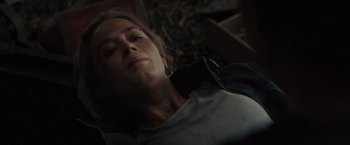 Movie still from “Edge of Tomorrow” (2014), directed by Doug Liman – A woman laying on the ground with her eyes closed; Close Up shot, High angle