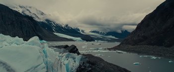 Movie still from “Edge of Tomorrow” (2014), directed by Doug Liman – A view of a lake and a mountain range; Extreme Wide shot, Low angle