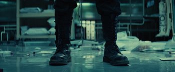 Movie still from “Edge of Tomorrow” (2014), directed by Doug Liman – View of a pair of black boots; Close Up shot, Low angle