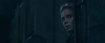 Movie still from “Edge of Tomorrow” (2014), directed by Doug Liman – A woman looking out of a window at night; Close Up shot, Over the shoulder angle