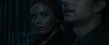 Movie still from “Edge of Tomorrow” (2014), directed by Doug Liman – A woman and a man are looking at the camera; Close Up shot, Over the shoulder angle