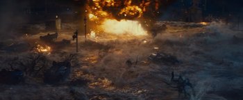 Movie still from “Edge of Tomorrow” (2014), directed by Doug Liman – An image of an explosion in the middle of a city; Extreme Wide shot, High angle