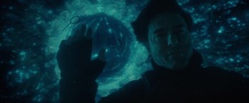 Movie still from “Edge of Tomorrow” (2014), directed by Doug Liman – A man in a black jacket is looking at the camera; Close Up shot, Overhead angle