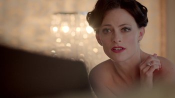 Movie still from “Sherlock” (2010), created by Steven Moffat – A person sitting in front of a mirror; Close Up shot, Over the shoulder angle