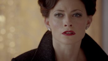 Movie still from “Sherlock” (2010), created by Steven Moffat – A person wearing a jacket; Close Up shot, Over the shoulder angle